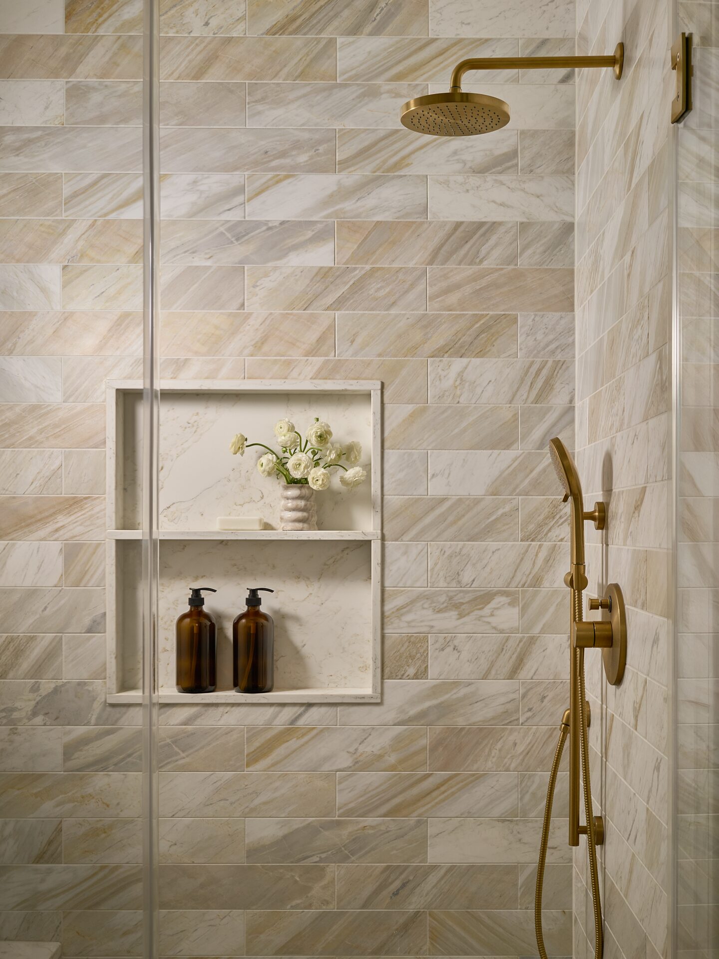 Overview Terrace shower niche with stone tile inlay and brass trim